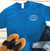 Blue Uranus Locksmith Co funny t-shirt styled with jeans from Uranus Fudge Factory