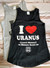 A flat lay of the black and gray I Love Uranus tank tops