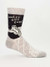 A grey novelty crew sock featuring a cartoon person looking sad next to the text "WORST GIFT EVER."