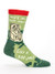 A green novelty crew sock featuring a cartoon man relaxing in an armchair with the text "Ain't no bad joke like a dad joke."
