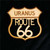 Wooden shield souvenir magnet featuring a Uranus Route 66 cutout design from Uranus Fudge Factory.