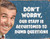 Retro style metal sign featuring a smiling man next to text about staff handling dumb questions.