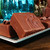 A close-up of a thick, homemade-style square of chocolate fudge from the Uranus Fudge Factory.
