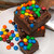 Chocolate Fudge with M&M's stacked on a plate, shipped directly from the Uranus Fudge Factory. 