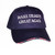 A navy blue baseball cap embroidered with white text from Uranus Fudge Factory.