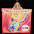 Woman holding up a large vinyl Sword Swallower banner from Uranus Sideshow Museum.