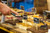 A hand choosing their fudge at the fudge counter or Uranus Fudge Factory