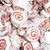 A close up bulk pile of wrapped white and red swirled red velvet cake salt water taffy candies