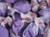 A close up bulk view of wrapped purple grape salt water taffy pieces ready for snacking