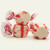 Three colorful wrapped Peppermint saltwater taffy candies stacked together on a plain white background by Uranus Fudge Factory.