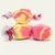 Three colorful wrapped Strawberry Banana saltwater taffy candies stacked together on a plain white background by Uranus Fudge Factory.