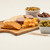 Charcuterie board with a bowl of Curry Redneck Nutz spicy peanuts.