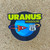 Die cut Uranus Missouri space planet cartoon souvenir sticker on wood from Uranus Fudge Factory