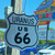 Uranus 66 shield shaped new car scented hanging air freshener front view from Uranus Fudge Factory