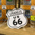 Front of Uranus 66 shield shaped new car scented hanging air freshener from Uranus Fudge Factory