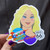 Miss Tiffany sticker held by a hand with purple nail polish against a dark backdrop by Uranus Fudge Factory.