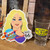 Miss. Tiffany sticker displayed on a wooden shelf beside a custom shot glass at Uranus Fudge Factory.