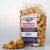 Fresh Buttery Caramel Corn package standing by a small loose pile of sweet snacks by Uranus Fudge Factory.