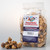 Peanut butter caramel corn package alongside a small pile of loose popcorn snacks by Uranus Fudge Factory.