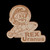 Cutout wooden magnet engraved with Rex Uranus riding a rocket graphic on black from Uranus Fudge Factory.
