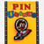 Rex Uranus riding a rocket hat pin attached to a yellow Pin Uranus card from Uranus Fudge Factory.