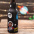 Black zippered bottle koolie with a space-themed Rex Uranus graphic from Uranus Fudge Factory.