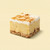 A square of Uranus Lemon Meringue Pie Fudge against a pastel yellow background.