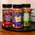 A lifestyle shot of the Uranus Spice Rubs trio, featuring Butt Rub, Deep Meat, and Rear Hen-try from the Uranus Fudge Factory.