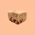 A square of Peach Cobbler Fudge against a peach background. 
