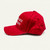 Side view of the red Make Uranus Great Again cap with curved brim and American flag underbill trim.