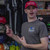 Man wearing the red Make Uranus Great Again hat in the apparel section at Uranus General Store.