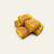 Hand-cut Lemon Iced Tea Fudge squares stacked on a cream background