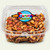 Uranus Fudge Factory peanut brittle in a labeled clear 1 lb. container, angled product view