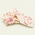 Stacked pieces of Uranus white chocolate peppermint bark topped with crushed red and white peppermint candy