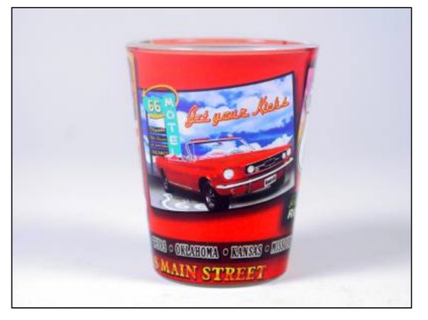 A red Route 66 souvenir shot glass featuring a classic red convertible car and a vintage neon motel sign