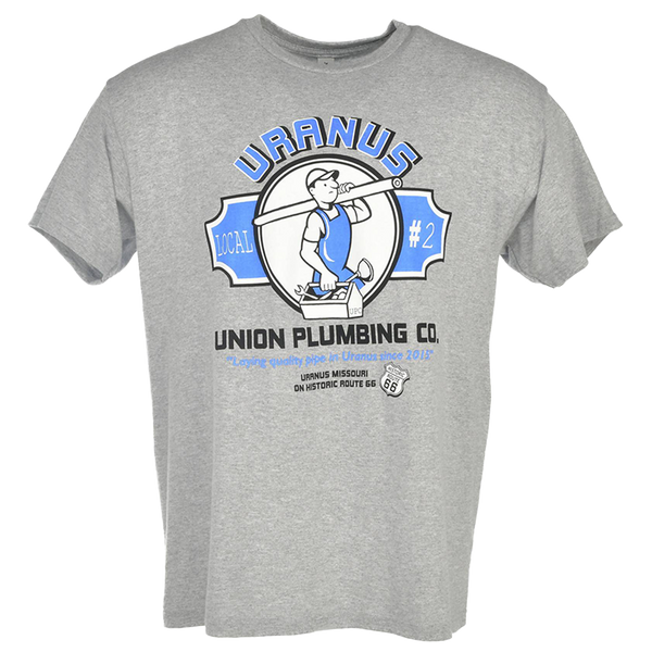 A heather gray t-shirt featuring a "Uranus Union Plumbing Co." graphic. The logo depicts a cartoon plumber carrying a pipe and a toolbox within a circular frame, flanked by blue banners that read "Local #2."