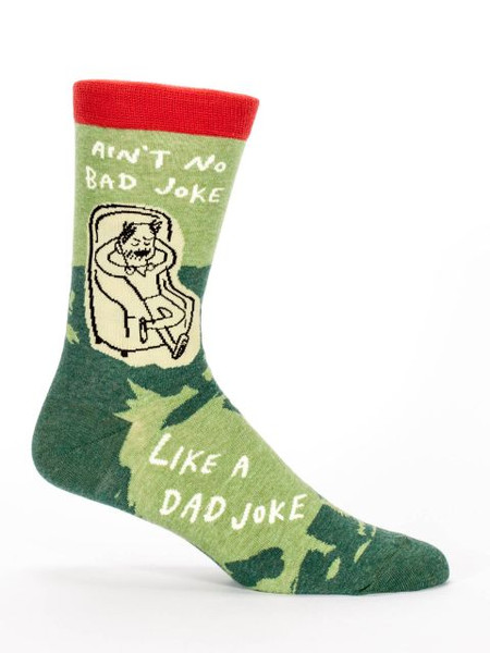A green novelty crew sock featuring a cartoon man relaxing in an armchair with the text "Ain't no bad joke like a dad joke."