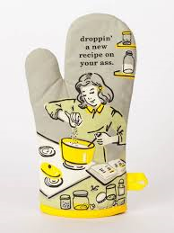 Grey oven mitt featuring a retro woman cooking with droppin' a new recipe text.