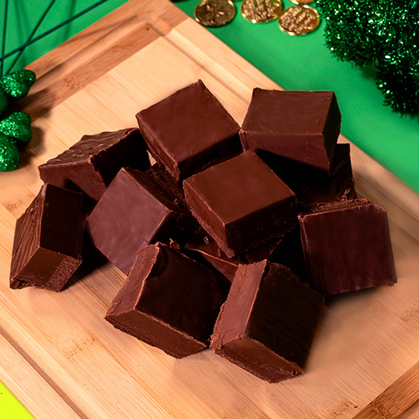 Chocolate Fudge from Uranus on a cutting board with ST. Patrick's Day decor.