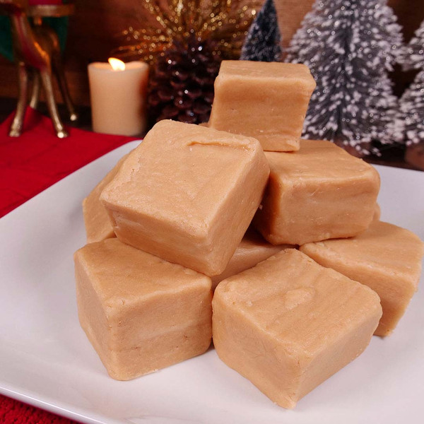Peanut Butter Fudge from Uranus stacked on a plate with Christmas decor