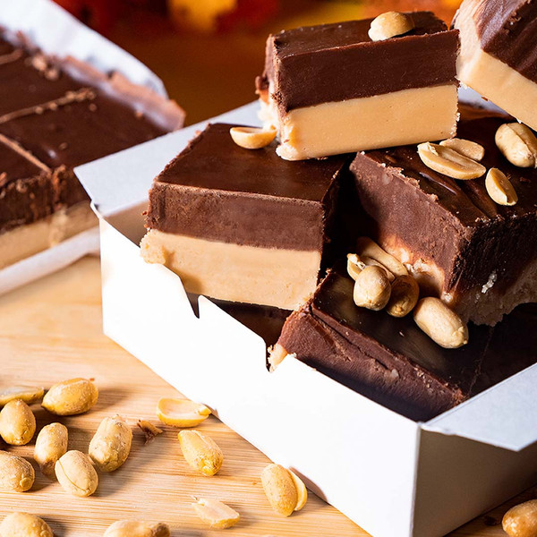 Reduced Sugar Peanut Butter Chocolate Fudge from Uranus in a box. Peanuts are in the foreground. Uranus Fudge Factory.