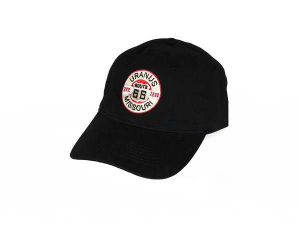 A black baseball cap against a plain white background. The front of the hat features a distressed, circular embroidered logo. The design includes a white Route 66 shield inside a red circle, crossed by a black horizontal bar reading "EST. 2000". The outer white ring of the logo displays the word "URANUS" arched across the top and "MISSOURI" arched across the bottom in bold black text.