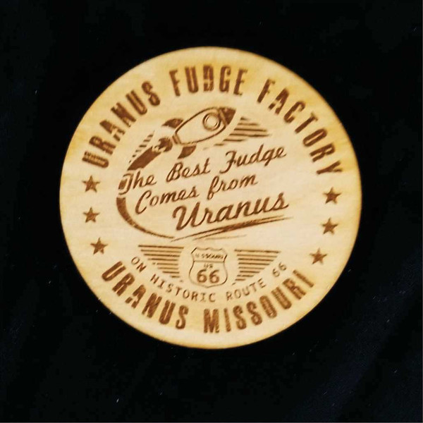 Laser-engraved wooden Best Fudge magnet featuring a retro rocket ship from Uranus Fudge Factory.