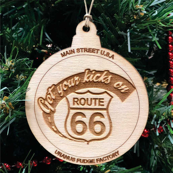 Laser-engraved wooden Christmas ornament featuring a Route 66 shield design from Uranus Fudge Factory.