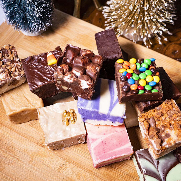 Big Package Sampler Fudge Platter from Uranus on a cutting board with Christmas decor