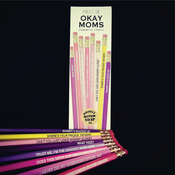 Packaged set of pink and purple Pencils for Okay Moms next to loose pencils.