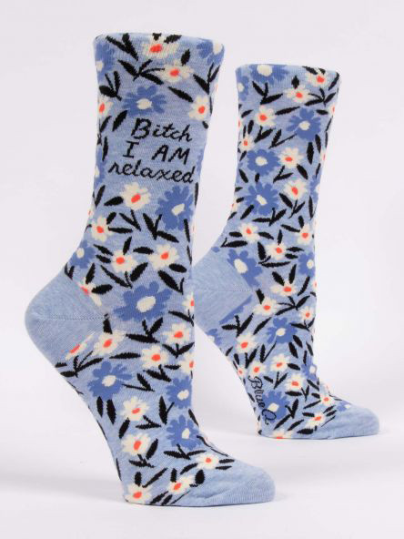 Light blue floral novelty crew socks with a funny sassy slogan text over a clean white background.