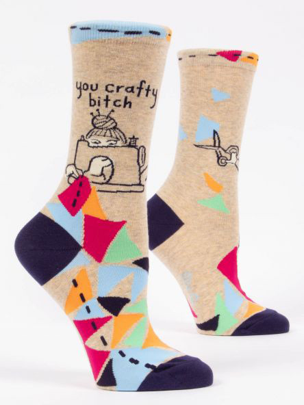 Tan quilting crew socks with a sewing machine and a funny you crafty bitch quote.