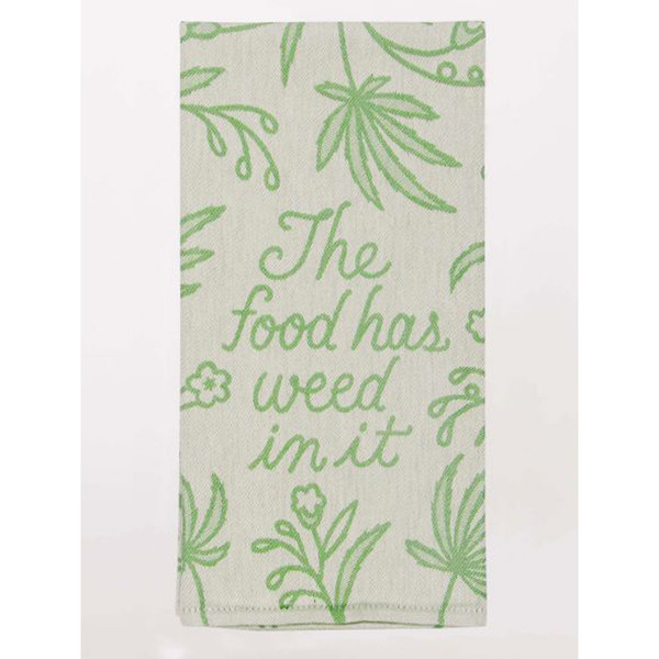Green and white kitchen towel featuring a funny The food has weed in it quote.