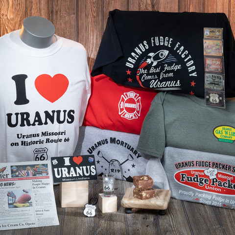 Group of funny souvenir t-shirts and gifts on display from Uranus Fudge Factory.